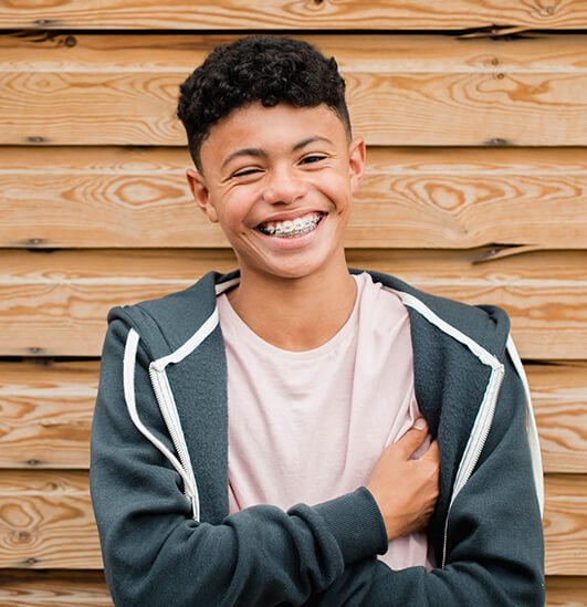 smiling young man wearing braces
